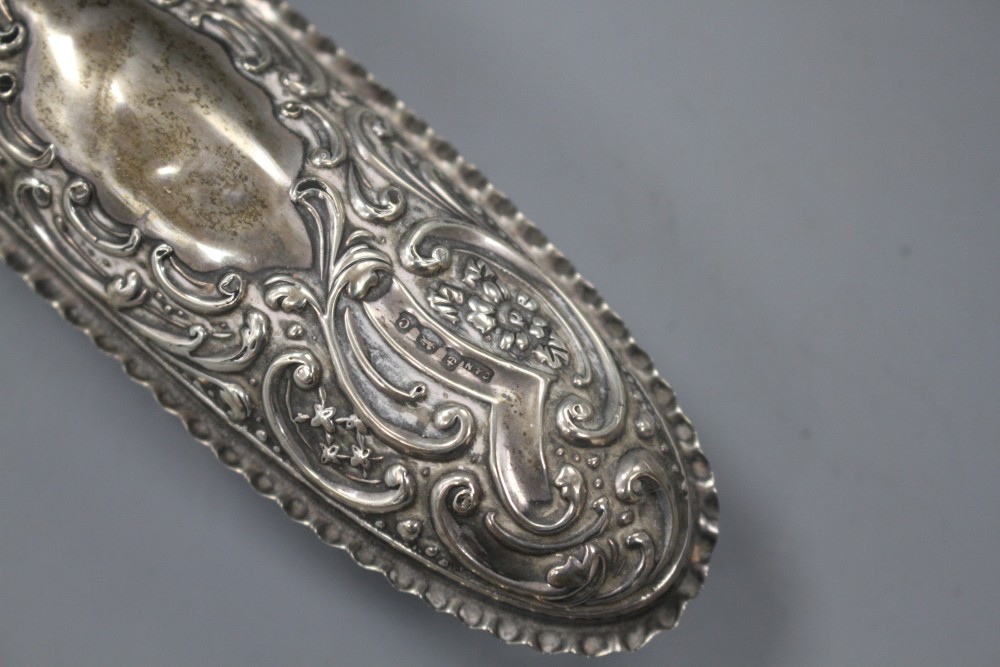 A late Victorian silver circular box and cover, a pair of similar silver mounted glass scent bottles, etc